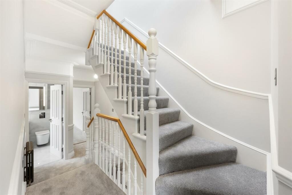 Bright staircase and landing at Turtle Green